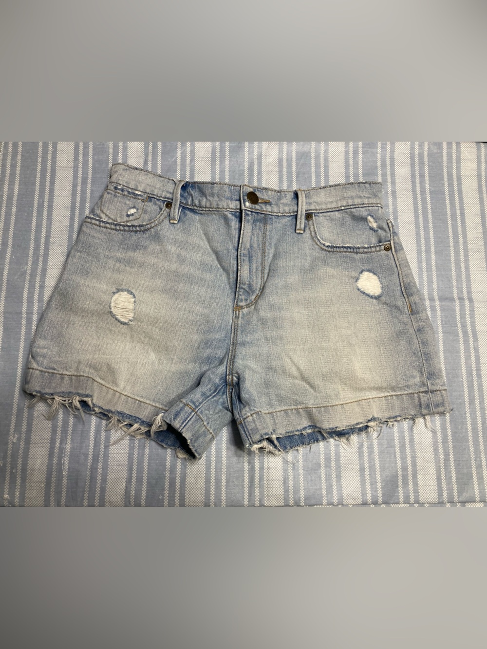 LOFT light blue distressed denim shorts.
